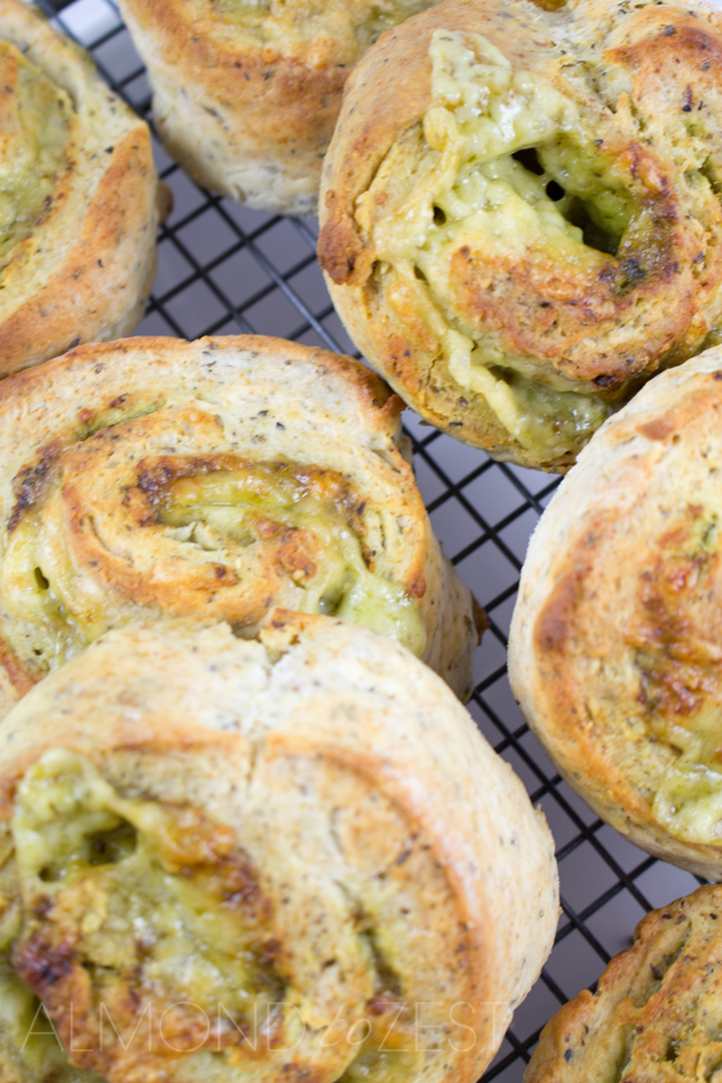 Herby Cheese Pinwheel Scones - Packed with mixed herbs, basil pesto and stuffed with cheese that melts into every crevice! These pinwheel scones are AMAZING!!
