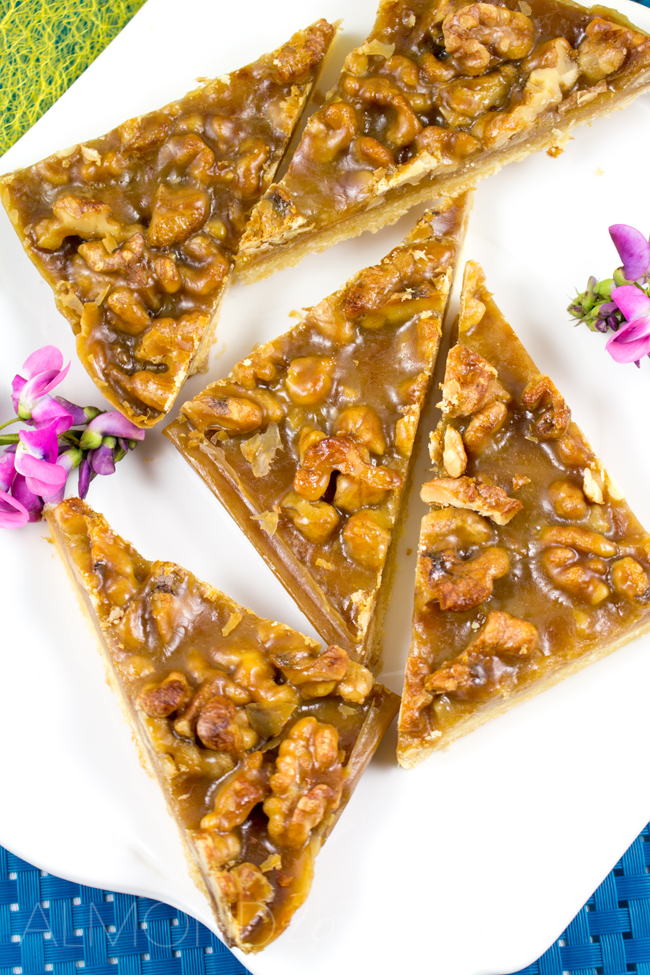 Caramel and Walnut Slice - Super soft, crumbly slice topped with crunchy walnuts and chewy caramel! You HAVE to try this it's crazy good!!
