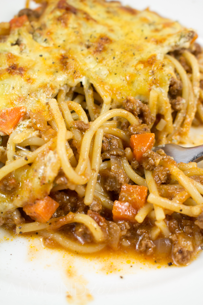 Spaghetti Bolognaise Bake - This spag bol bake will become a family favorite loaded with flavor, a creamy texture and a crispy golden cheese layer! YUM!!